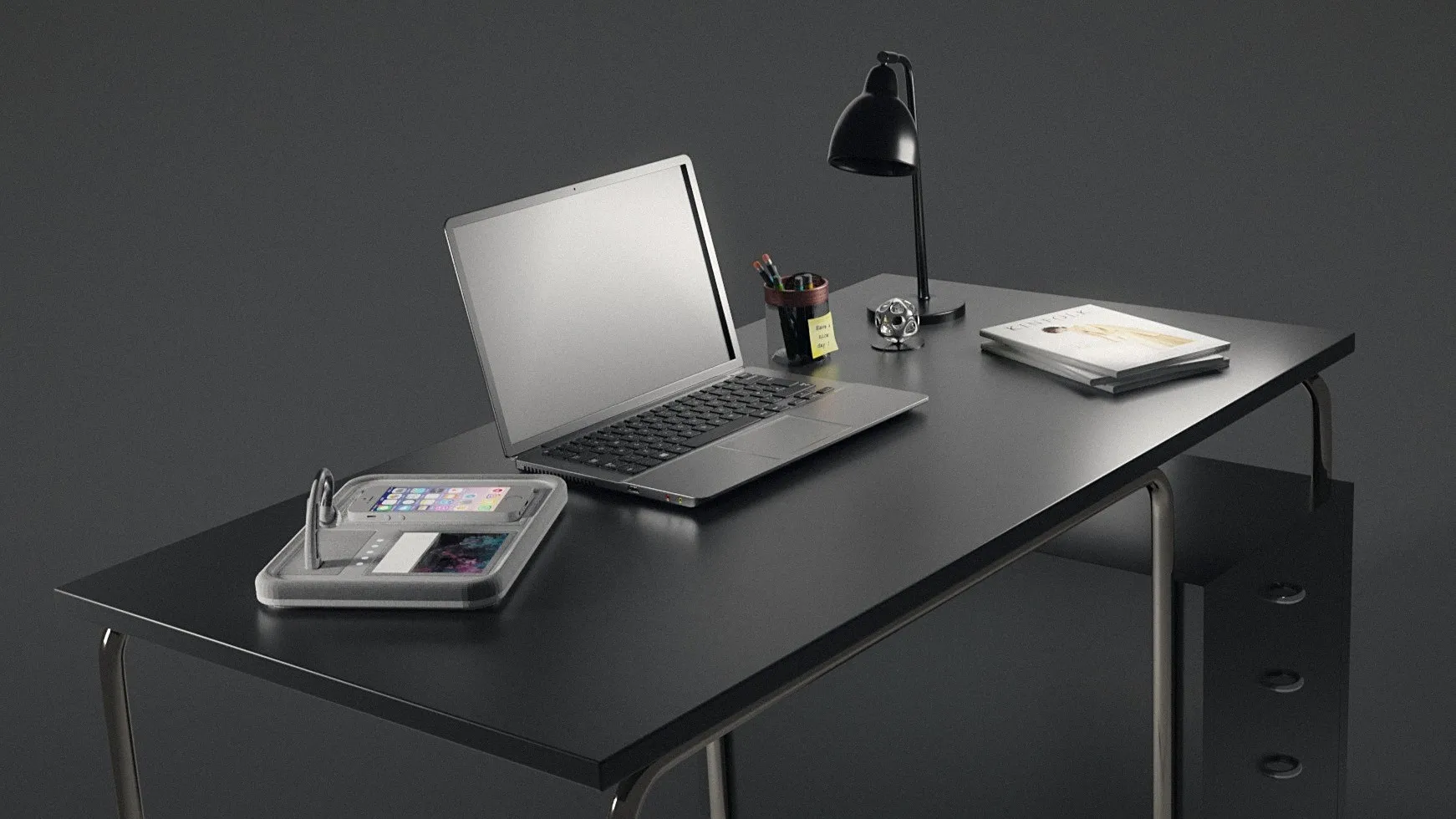 Heron's desk dock beside a laptop
